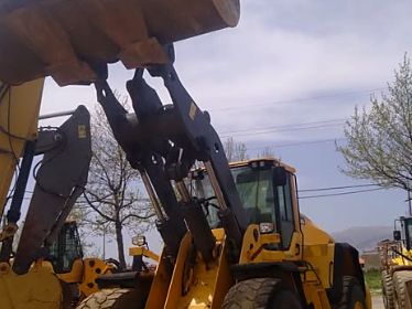 Volvo wheel loader with raised bucket